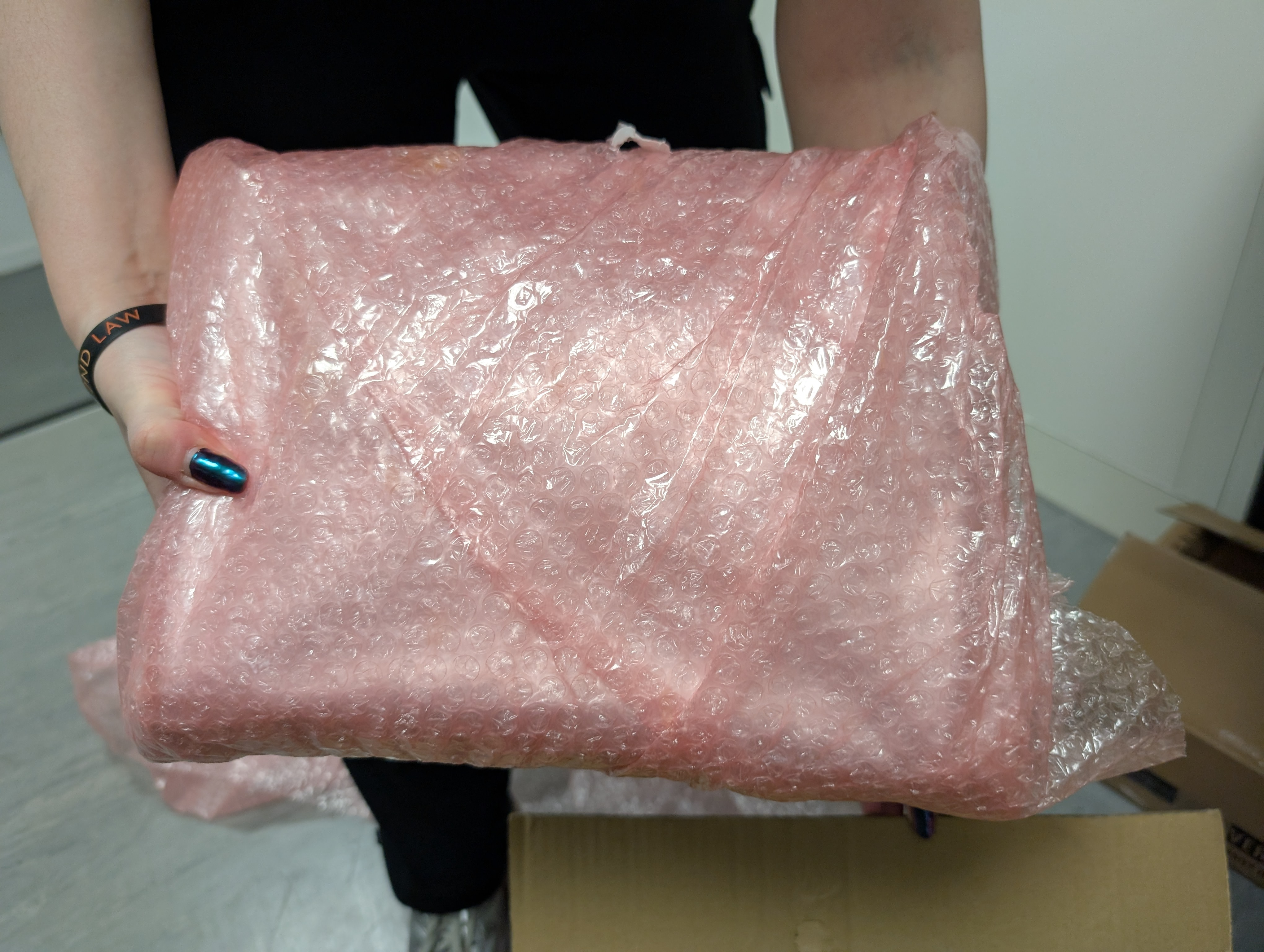 Bubble wrap around sealed hybrid panel shipping box.